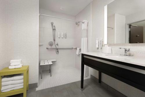 a white bathroom with a sink and a shower at Hampton Inn & Suites El Paso/East in El Paso