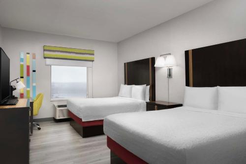 a hotel room with two beds and a window at Hampton Inn & Suites El Paso/East in El Paso