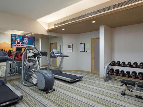 a fitness room with a gym with tread machines at ibis Pune Hinjewadi - An Accor Brand in Pune