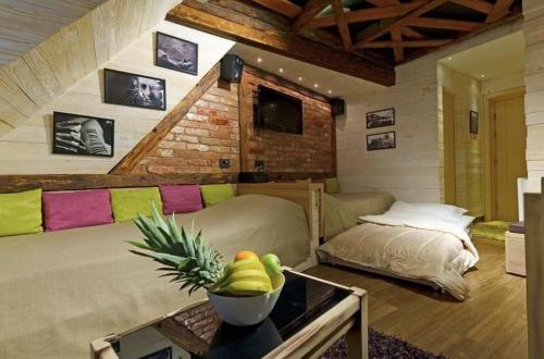 a living room with a couch and a table at Konaci”Rile-Men” in Kopaonik