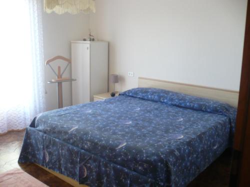 Postel nebo postele na pokoji v ubytování Appartamento Michela