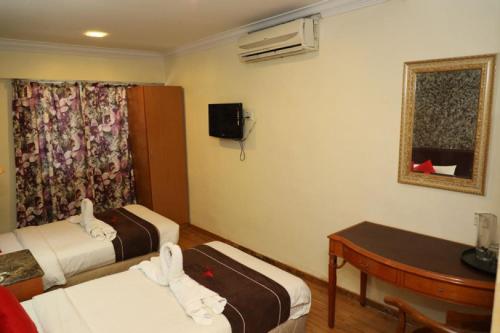 Ліжко або ліжка в номері Hotel Wings Kuala Lumpur