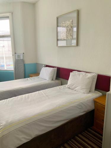 Cama o camas de una habitación en Bromptons