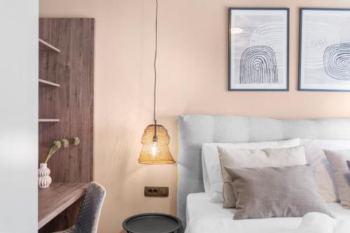 a bedroom with a bed and a table and a lamp at Quercus Village Penthouse with jacuzzi in Novigrad Istria