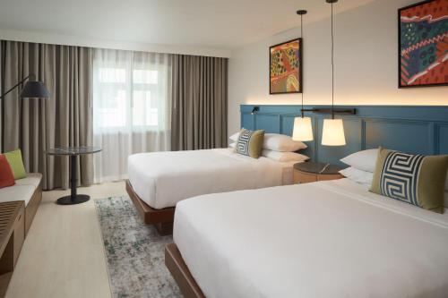 Postel nebo postele na pokoji v ubytování Hotel Rumbao, a Tribute Portfolio Hotel