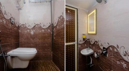 a bathroom with a toilet and a shower and a sink at Wind Flower Hotel New Aadya International Near International Airport in Mumbai