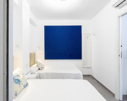 Postel nebo postele na pokoji v ubytování Edificio Sirena