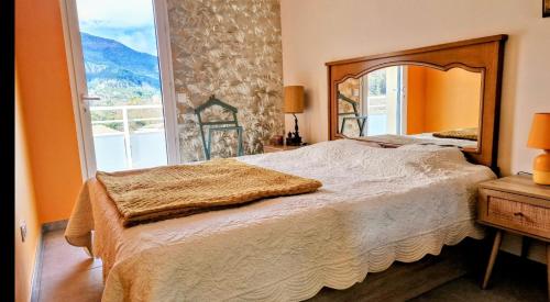 Postel nebo postele na pokoji v ubytování Appartement neuf, avec vue montagnes.