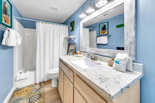 a bathroom with a sink and a toilet at Shores of Panama 1816 in Panama City Beach