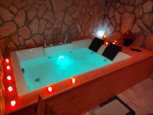 a jacuzzi tub with lights in a room at SPA Suite 21 in Augusta