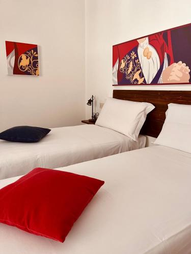 Ένα ή περισσότερα κρεβάτια σε δωμάτιο στο Carrales Guest House