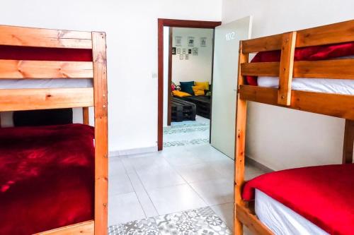 a room with two bunk beds and a hallway at MARHABA INN by HB Hostels in Tétouan