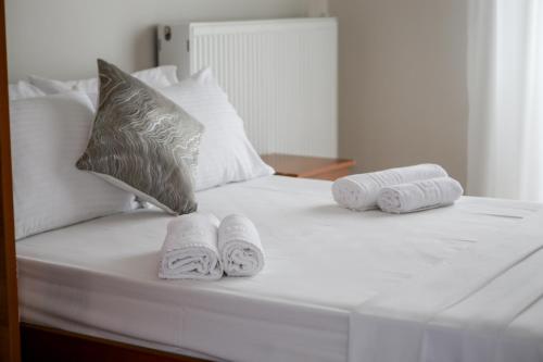 Ένα ή περισσότερα κρεβάτια σε δωμάτιο στο Athanasia inn