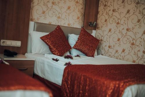 Letto o letti in una camera di Aleria Belport Beach Hotel