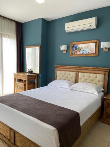 Postel nebo postele na pokoji v ubytování Veziroğlu Apart