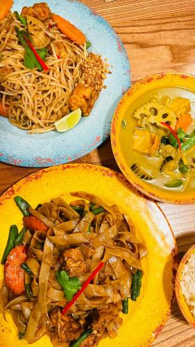 a table with three bowls of food with noodles at Frederick House Hotel in Edinburgh