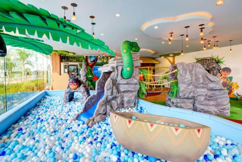 a water park with a dinosaur pool and balls at DoubleTree by Hilton - Resort - Foz do Iguaçu in Foz do Iguaçu
