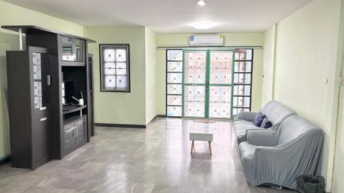 a living room with a couch and a table at Bang Saen House: Friends/Family. in Ban Thai Don (1)