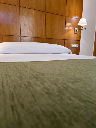 Postel nebo postele na pokoji v ubytování Hotel Tio Pepe