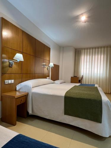 Postel nebo postele na pokoji v ubytování Hotel Tio Pepe