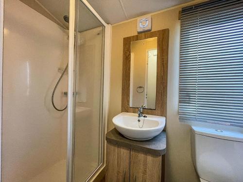 a bathroom with a sink and a shower at Great Caravan For Hire By The Beach In Norfolk, By Hunstanton Beach Ref 13005l in Hunstanton