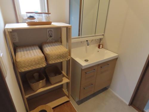 a bathroom with a sink and a mirror at Awajishima Cottage Hitotoki - Vacation STAY 10755v in Sumoto