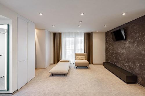 TV a/nebo společenská místnost v ubytování HVOYA Apart-Hotel & SPA