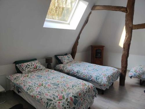 Ένα ή περισσότερα κρεβάτια σε δωμάτιο στο Maison de 3 chambres avec jardin clos et wifi a Offranville a 4 km de la plage