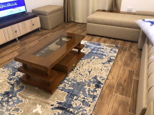 a living room with a coffee table and a couch at Al-Andalos Studio in New cairo