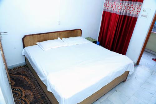 Postel nebo postele na pokoji v ubytování Madhuban Homestay, Natraj Chowk