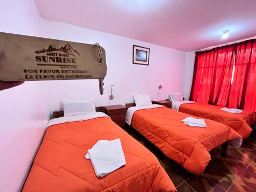 Postel nebo postele na pokoji v ubytování Sunrise Guest House
