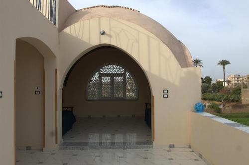 an entrance to a building with an archway at Mogran Guest House in Luxor
