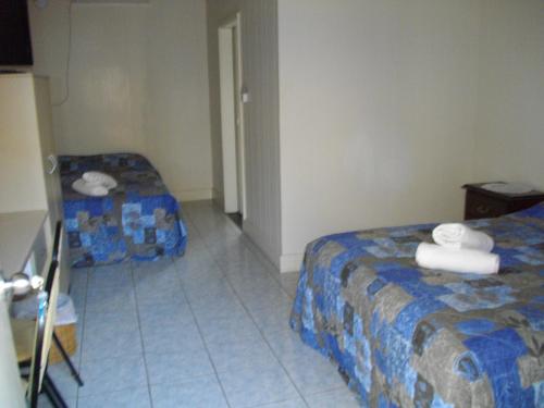 Postel nebo postele na pokoji v ubytování Kurrimine Beach Motel