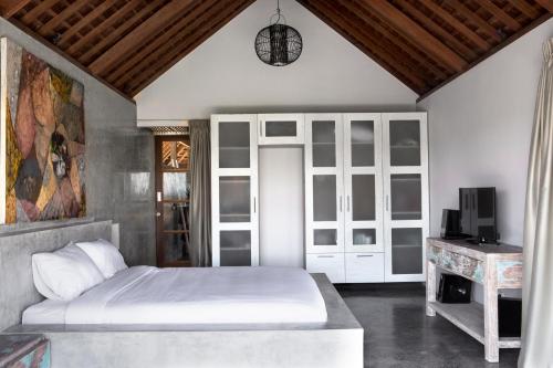 Cama o camas de una habitación en Surflodge Limasan Bali