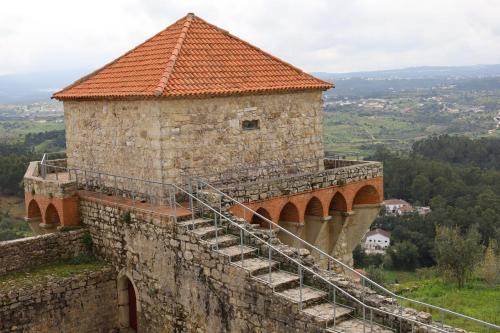 a stone building with stairs on the side of it at Hotel Dom Goncalo & Spa in Fátima