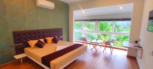 Ένα ή περισσότερα κρεβάτια σε δωμάτιο στο Hillside Naturestay