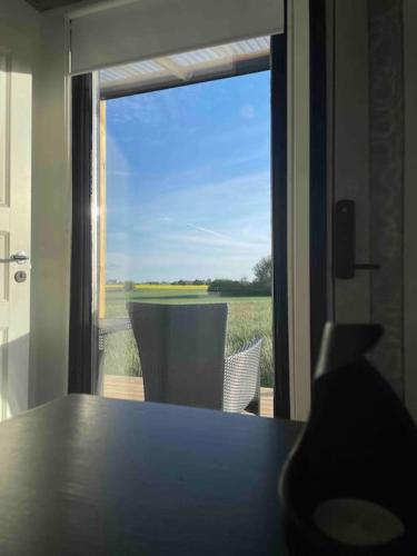 a table in a room with a view of a window at Container in Hammenhög
