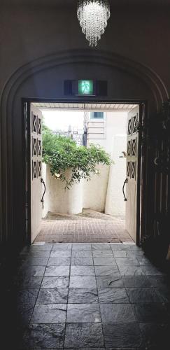 an entrance to a building with an open door at Asan Paradise in Asan