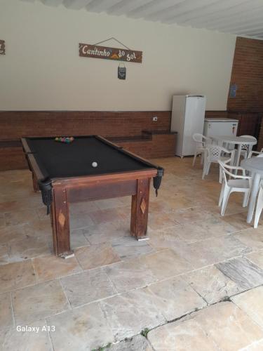 a pool table sitting on top of a floor at Elysian Place in Atibaia