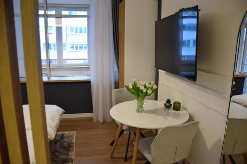 a small room with a table and a window at RED RIDING HOOD in Belgrade