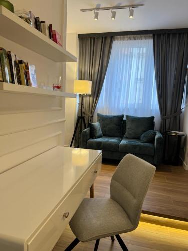a living room with a couch and a chair at RED RIDING HOOD in Belgrade
