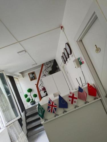 an overhead view of a room with a staircase with flags at Pak Az Deluxe Hotel in Baku