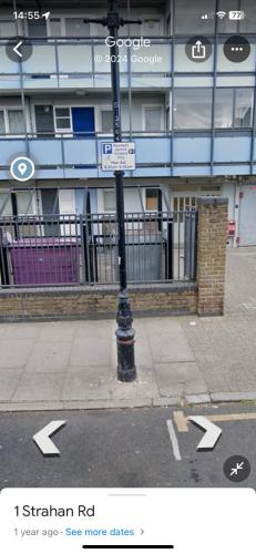 a street sign on a pole in front of a building at Newport in London