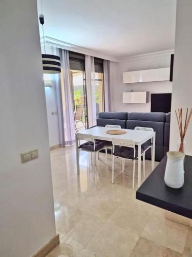 a living room with a white table and a couch at Apto. Residencial Poniente en San Javier in San Javier