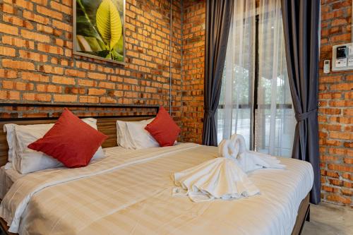 Postel nebo postele na pokoji v ubytování Sebayu Retreat Gopeng