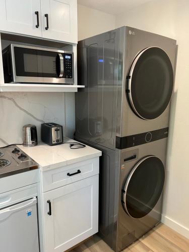 a kitchen with a refrigerator and a microwave at One room with one queen bed studio to rent in Palo Alto