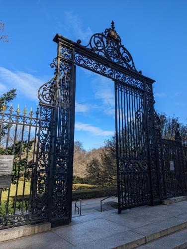 an ornate black gate in front of a park at THE CENTRAL PARK EAST by THE MUSEUM MILE in New York