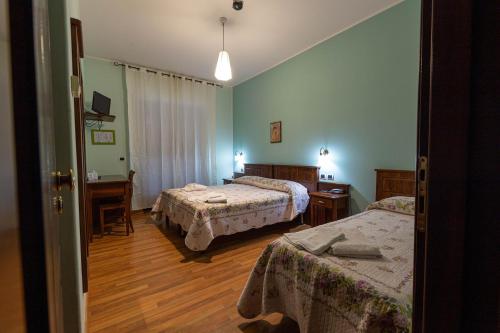 Posteľ alebo postele v izbe v ubytovaní Hotel Pina Ristorante