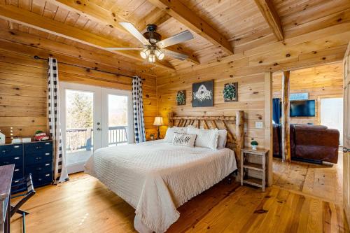 a bedroom with a bed and a ceiling fan at Lost Indian Hideaway in Whittier