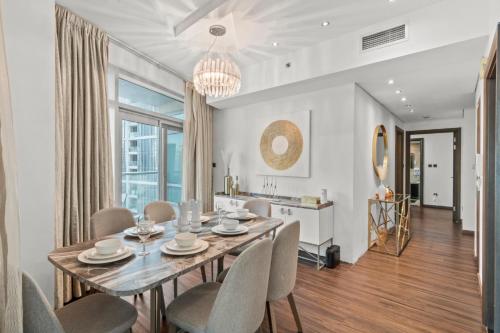 a dining room with a table and chairs at The Lofts - Luxurious space with Burj Khalifa View in Dubai